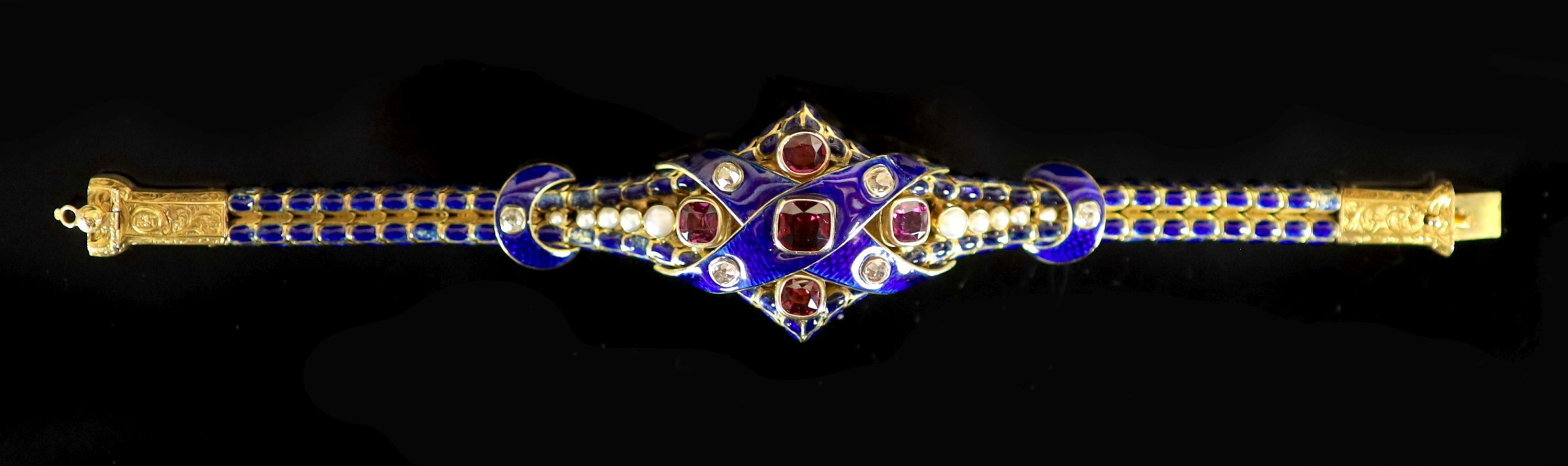 A good Victorian gold, blue enamel, old cut diamond, foil backed garnet and graduated split pearl set articulated memorial bracelet